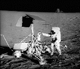 Apollo 12 astronaut on the Moon at Surveyor 3 landing site